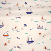 Tissu cotonnade blanc aux petits bateaux bleus et oranges - STANDARD 100 OEKO - TEX - TissusPapi.com