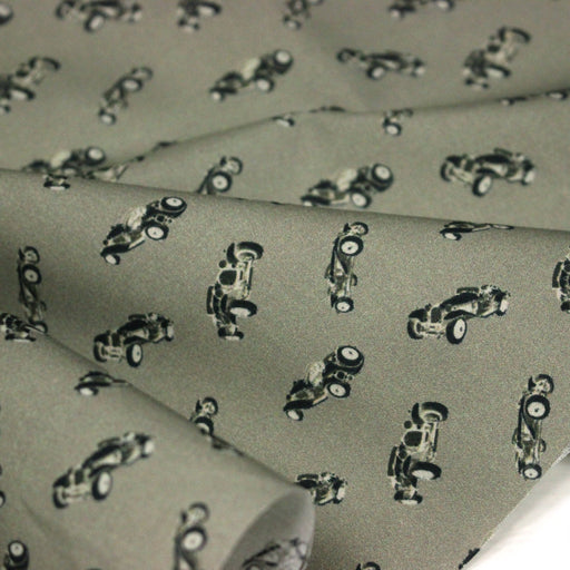 Tissu popeline coton aux petites voitures ancienne, fond vert kaki - TissusPapi.com