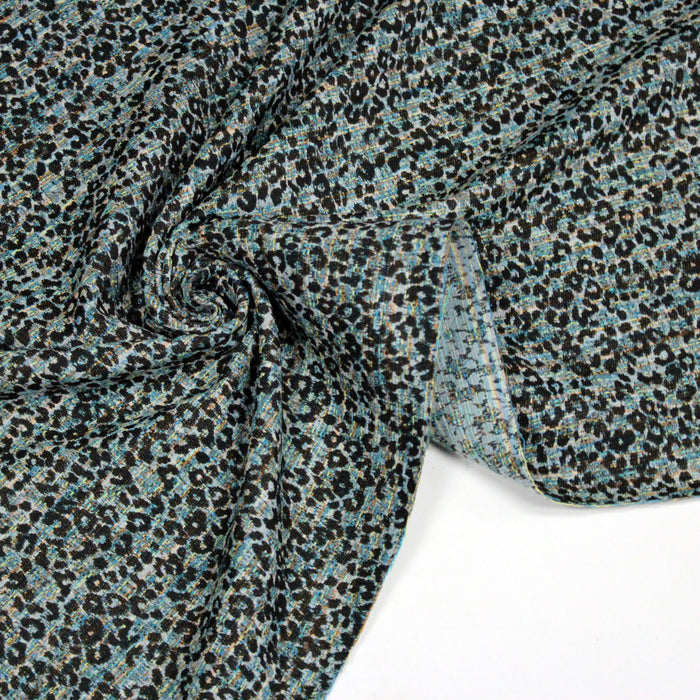 Tissu jacquard motif léopard noir sur fond faux uni vert bleu - COLLECTION LEOPARD