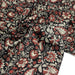 Tissu coton fin imprimé INDIENNES noir aux fleurs traditionnelles indiennes rouges et écrues - TissusPapi.com