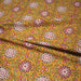 Tissu coton fin imprimé INDIENNES, jaune safran, rosaces rouges et écrues – STANDARD 100 OEKO - TEX - TissusPapi.com