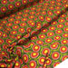 Tissu cotonnade aux fleurs SEVENTIES roses jaunes et rouges, fond kaki - OEKO-TEX STANDARD 100 - TissusPapi.com
