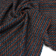 Tissu lainage faux-uni aux touches noires, corail, bleues, blanches - Fabrication italienne - TissusPapi.com