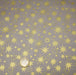 Tissu coton Noël, gris aux étoiles dorées - TissusPapi.com