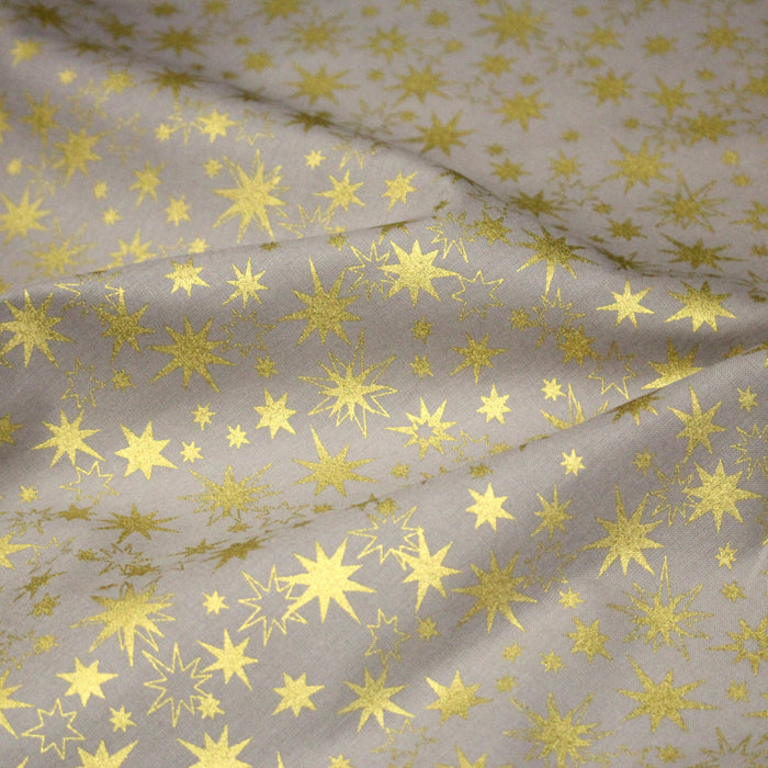 Tissu coton Noël, gris aux étoiles dorées - TissusPapi.com