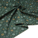 Tissu cotonnade vert aux notes de musique en étoiles - STANDARD 100 OEKO - TEX - TissusPapi.com