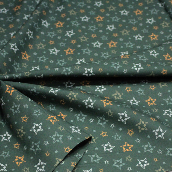 Tissu cotonnade vert aux notes de musique en étoiles - STANDARD 100 OEKO - TEX - TissusPapi.com