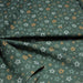 Tissu cotonnade vert aux notes de musique en étoiles - STANDARD 100 OEKO - TEX - TissusPapi.com