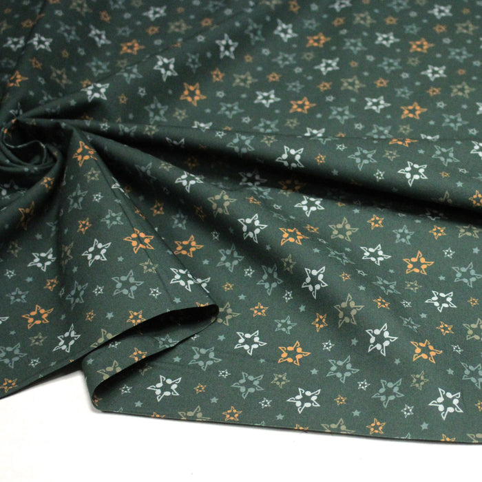 Tissu cotonnade vert aux notes de musique en étoiles - STANDARD 100 OEKO - TEX - TissusPapi.com