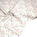 Tissu cotonnade enfant blanc aux éléphants & feuilles tropicales - STANDARD 100 OEKO - TEX - TissusPapi.com