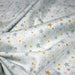 Tissu cotonnade bleu ciel aux étoiles bleues et jaunes - STANDARD 100 OEKO - TEX - TissusPapi.com
