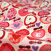 Tissu cotonnade POMME D'AMOUR, coeurs roses et pommes rouges - TissusPapi.com