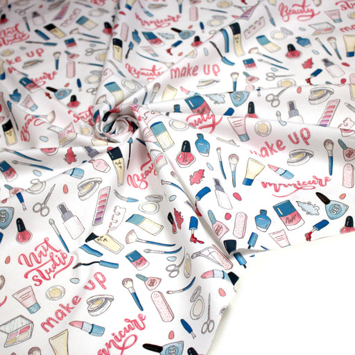 Tissu cotonnade MAKE - UP GIRLY, motifs maquillages et parfums, tons roses, bleus, écrus - TissusPapi.com