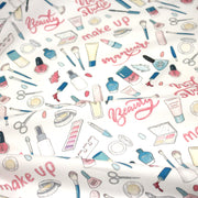 Tissu cotonnade MAKE - UP GIRLY, motifs maquillages et parfums, tons roses, bleus, écrus - TissusPapi.com