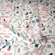 Tissu cotonnade MAKE - UP GIRLY, motifs maquillages et parfums, tons roses, bleus, écrus - TissusPapi.com