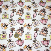 Tissu cotonnade MAKE - UP GIRLY, motifs bouteilles de parfum multicolores - TissusPapi.com