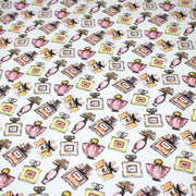 Tissu cotonnade MAKE - UP GIRLY, motifs bouteilles de parfum multicolores - TissusPapi.com