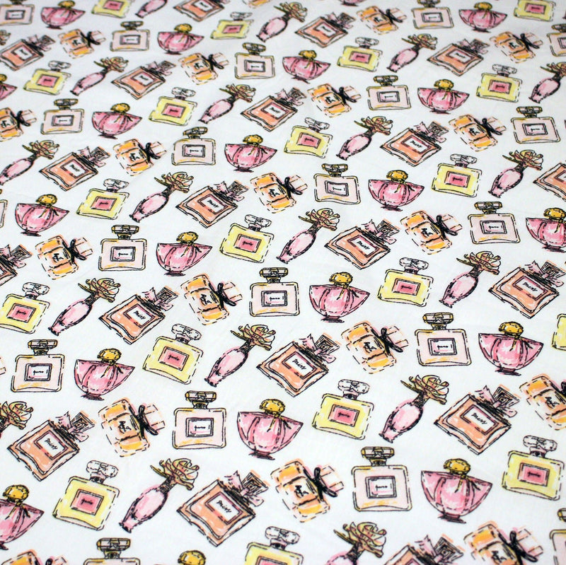 Tissu cotonnade MAKE - UP GIRLY, motifs bouteilles de parfum multicolores - TissusPapi.com