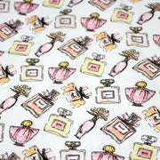 Tissu cotonnade MAKE - UP GIRLY, motifs bouteilles de parfum multicolores - TissusPapi.com