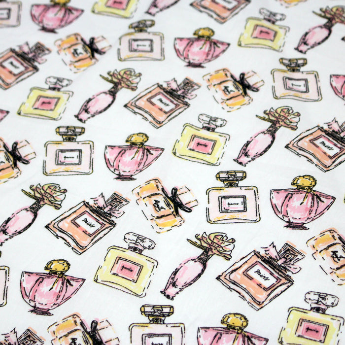 Tissu cotonnade MAKE - UP GIRLY, motifs bouteilles de parfum multicolores - TissusPapi.com
