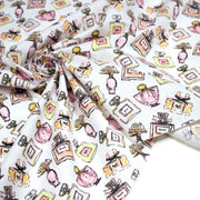 Tissu cotonnade MAKE - UP GIRLY, motifs bouteilles de parfum multicolores - TissusPapi.com