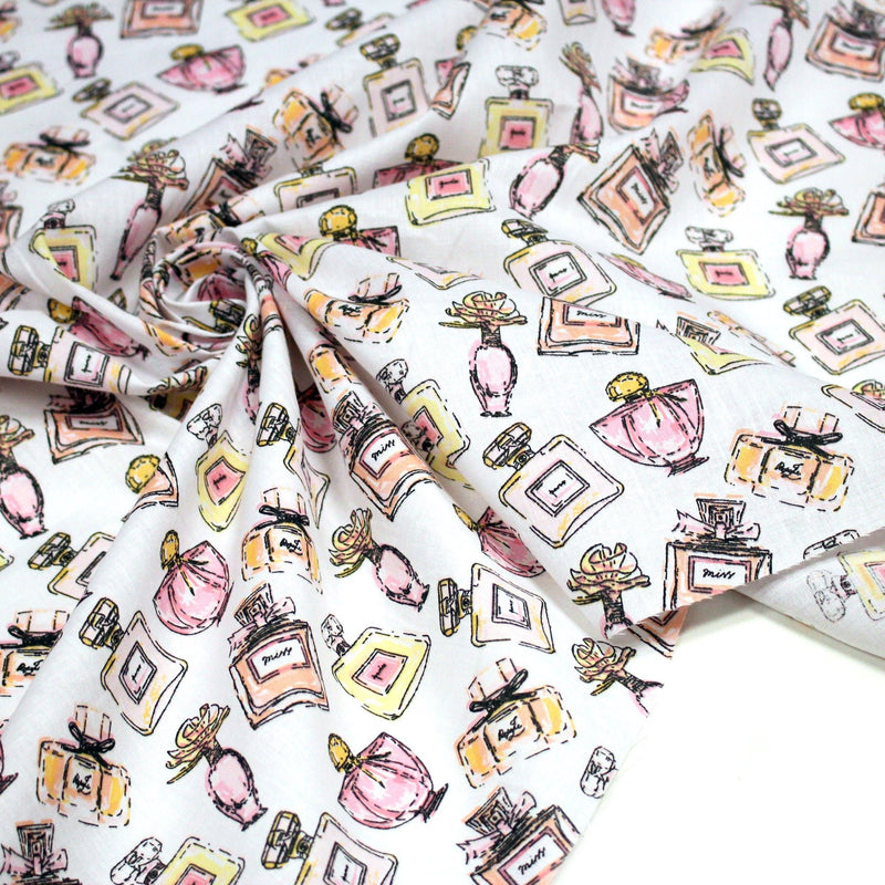 Tissu cotonnade MAKE - UP GIRLY, motifs bouteilles de parfum multicolores - TissusPapi.com