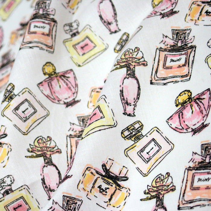 Tissu cotonnade MAKE - UP GIRLY, motifs bouteilles de parfum multicolores - TissusPapi.com