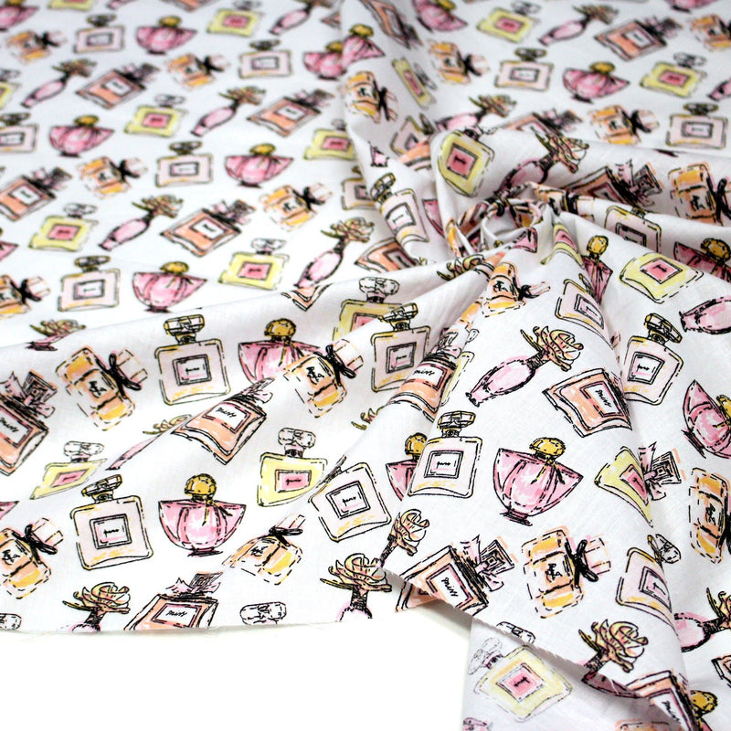 Tissu cotonnade MAKE - UP GIRLY, motifs bouteilles de parfum multicolores - TissusPapi.com