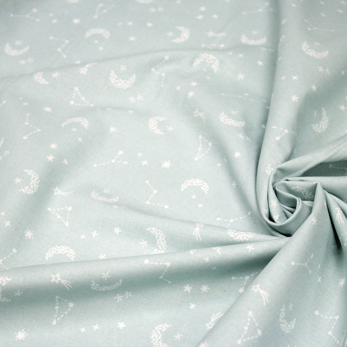 Tissu cotonnade enfant, constellation blanche, lune et étoiles fond vert clair - OEKO - TEX STANDARD 100 - TissusPapi.com