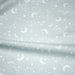 Tissu cotonnade enfant, constellation blanche, lune et étoiles fond vert clair - OEKO - TEX STANDARD 100 - TissusPapi.com