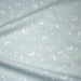 Tissu cotonnade enfant, constellation blanche, lune et étoiles fond vert clair - OEKO - TEX STANDARD 100 - TissusPapi.com