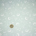 Tissu cotonnade enfant, constellation blanche, lune et étoiles fond vert clair - OEKO - TEX STANDARD 100 - TissusPapi.com