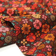 Tissu velours milleraies imprimé SEVENTIES choco aux fleurs rouge roses oranges - STANDARD 100 OEKO-TEX - TissusPapi.com