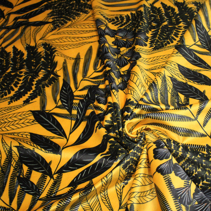 Tissu Velours ras motif tropical, tons jaunes et noirs