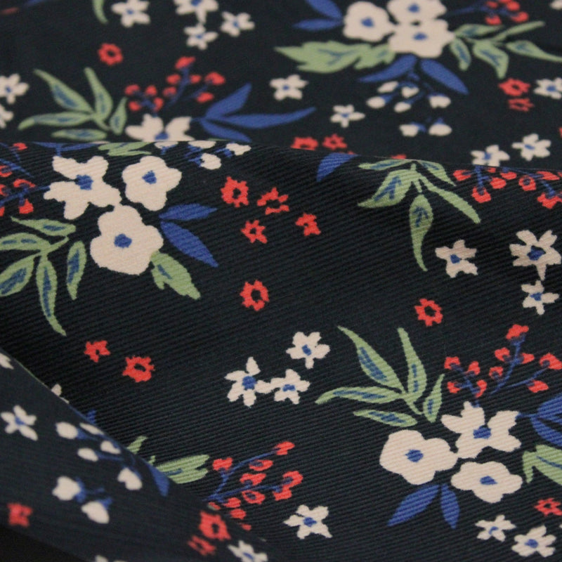 Tissu velours milleraies imprimé noir aux fleurs écrues, bleues, vertes - STANDARD 100 OEKO-TEX - TissusPapi.com