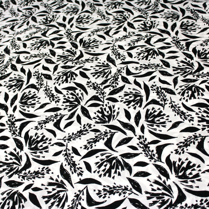 Tissu viscose fluide fond blanc aux fleurs noires dessinées - OEKO-TEX®