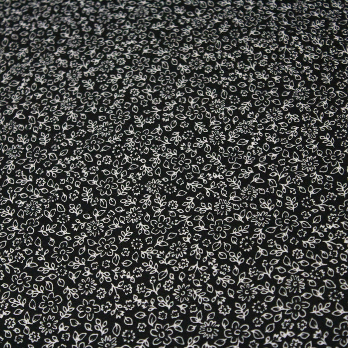 Tissu Microfibre de viscose fond noir aux fines fleurs blanches - OEKO-TEX®