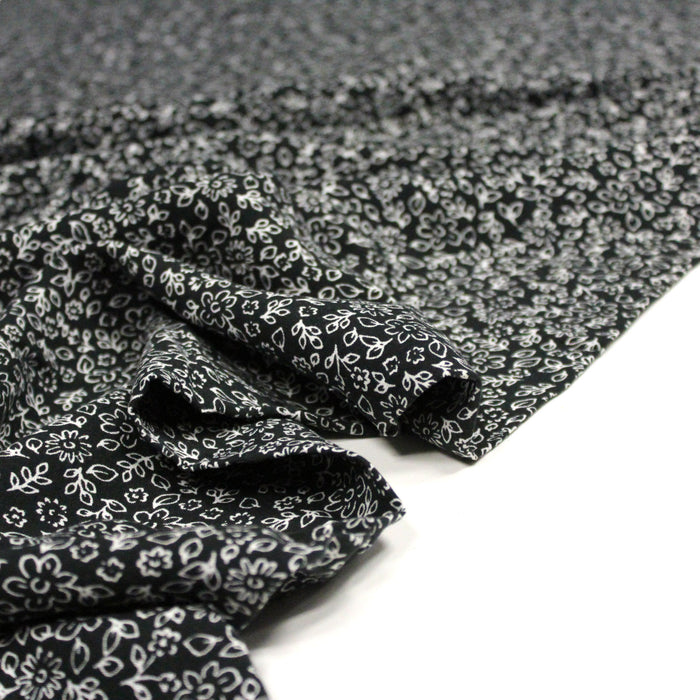 Tissu Microfibre de viscose fond noir aux fines fleurs blanches - OEKO-TEX®