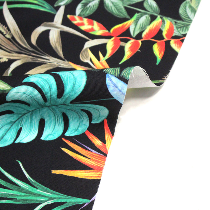 Tissu gabardine de coton LUXE imprimée motif de forêt tropical luxuriante multicolore, fond noir