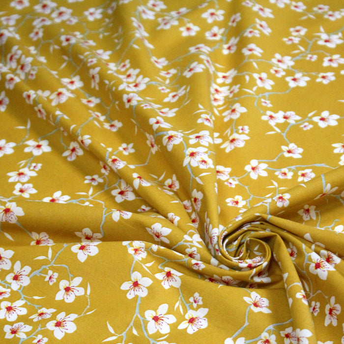 Tissu coton jaune moutarde aux fleurs d'amandier - OEKO-TEX