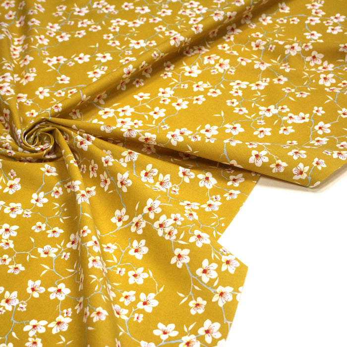 Tissu coton jaune moutarde aux fleurs d'amandier - OEKO-TEX