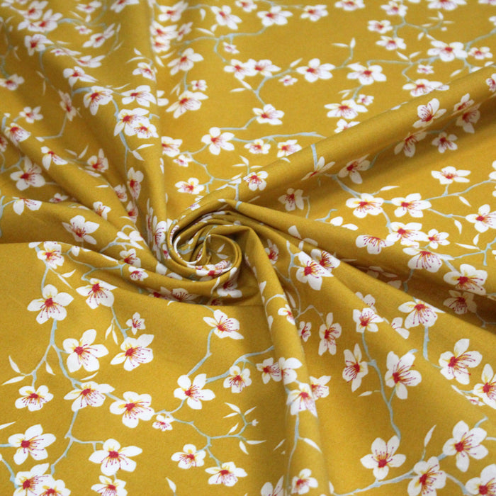 Tissu coton jaune moutarde aux fleurs d'amandier - OEKO-TEX