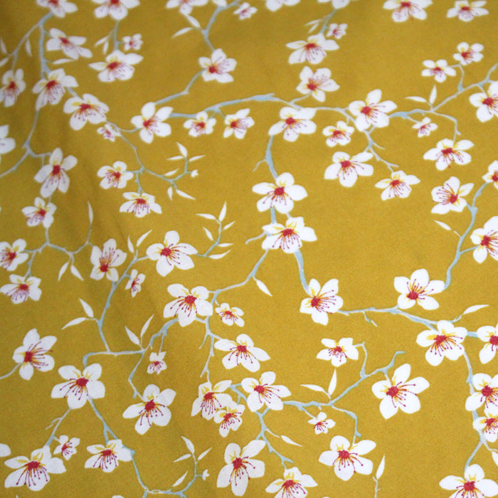 Tissu coton jaune moutarde aux fleurs d'amandier - OEKO-TEX