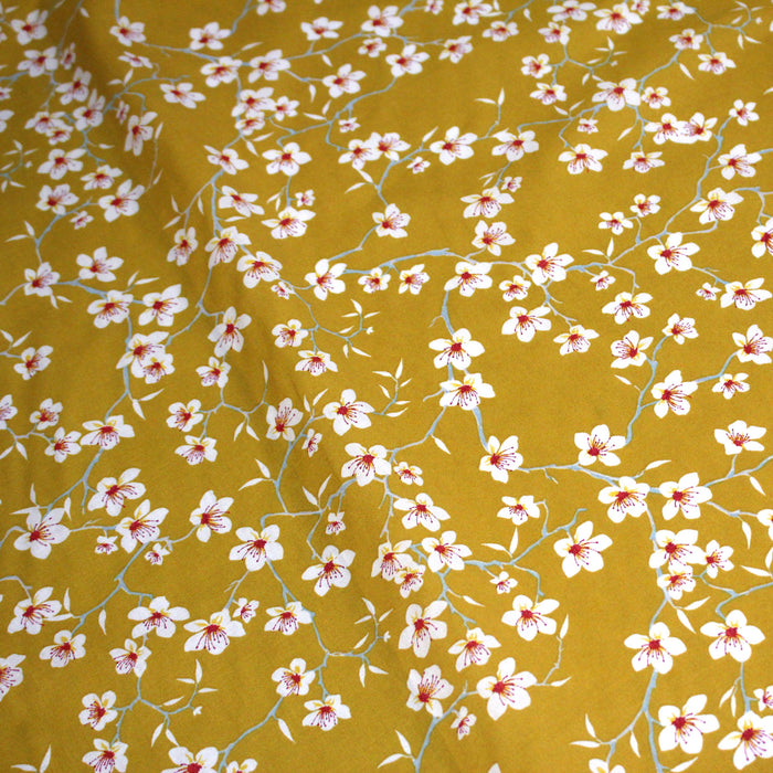 Tissu coton jaune moutarde aux fleurs d'amandier - OEKO-TEX