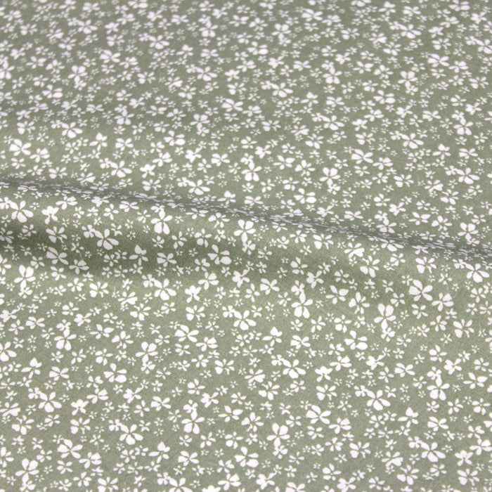 Tissu de coton vert amande aux fleurs blanches - OEKO-TEX