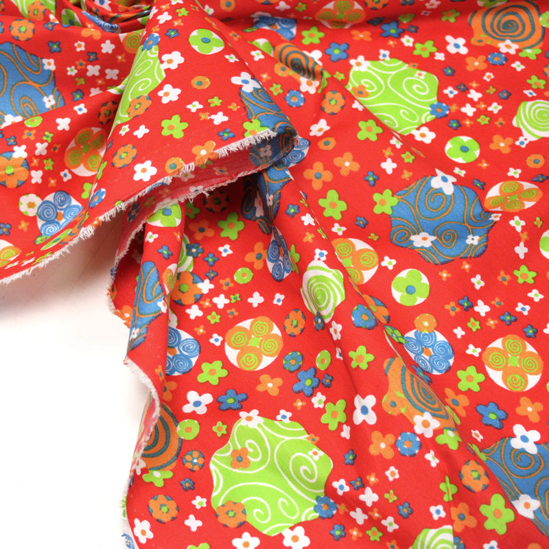 Tissu cotonnade SEVENTIES rouge et formes psychédéliques oranges, bleues, vertes