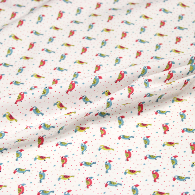 Tissu cotonnade enfant aux petits toucans multicolores sur fond blanc