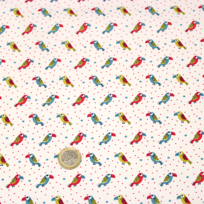 Tissu cotonnade enfant aux petits toucans multicolores sur fond blanc