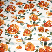 Tissu gabardine coton imprimée blanc aux roses oranges façon aquarelle - TissusPapi.com