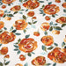 Tissu gabardine coton imprimée blanc aux roses oranges façon aquarelle - TissusPapi.com